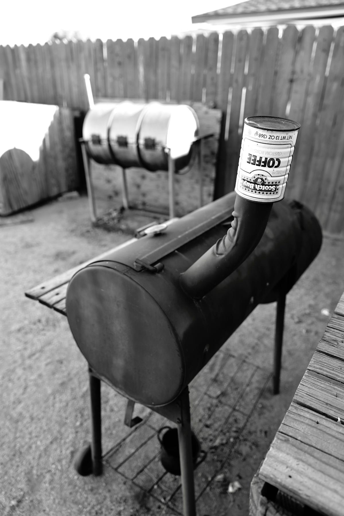 A backyard barbecue smoker setup, the kind of pellet or offset rig people compare when choosing a cooker for brisket